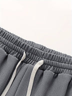Conjunto masculino de duas peças em tecido waffle, fit relaxado e respirável