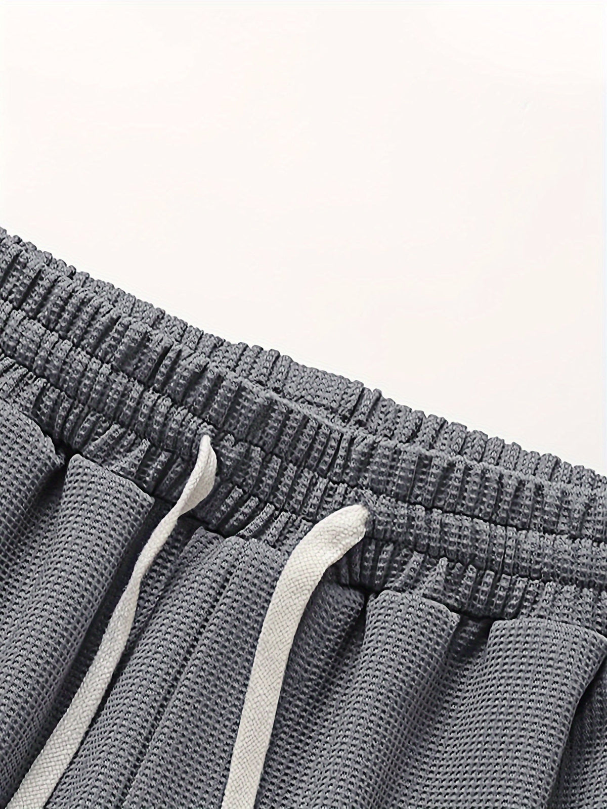 Conjunto masculino de duas peças em tecido waffle, fit relaxado e respirável