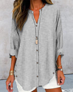 Blusa feminina manga longa listrada decote V com botões corte folgado