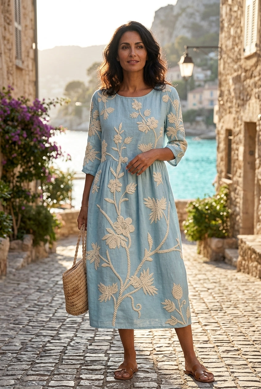 Vestido midi bordado floral linho algodão mangas três quartos corte fluido