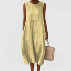 Vestido feminino sem mangas com bordado floral e bolsos laterais ocultos