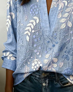 Blusa feminina floral com decote em V, tecido leve e estampa pastel