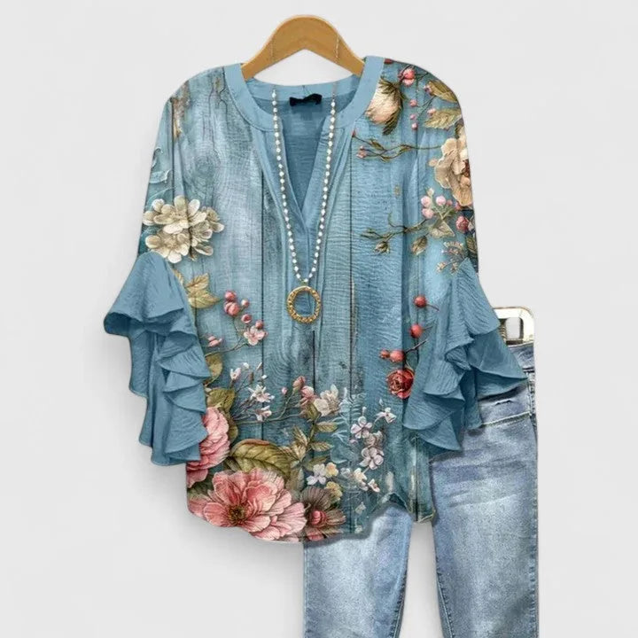 Blusa feminina floral com mangas 3/4 com babados e decote em V