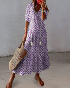 Vestido feminino boho maxi com detalhes de franjas e mangas largas