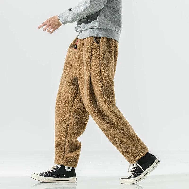 Calças de moletom fleece corte relaxado com cós elástico e cordão
