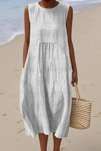 Vestido midi feminino sem mangas com bordado floral tonal e silhueta folgada