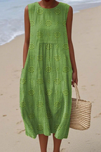 Vestido midi feminino sem mangas com bordado floral tonal e silhueta folgada