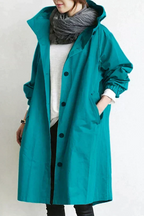 Impermeável feminino com capuz oversize respirável corte urbano