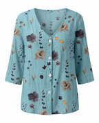 Blusa feminina floral decote V manga três quartos caimento solto