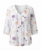 Blusa feminina floral decote V manga três quartos caimento solto